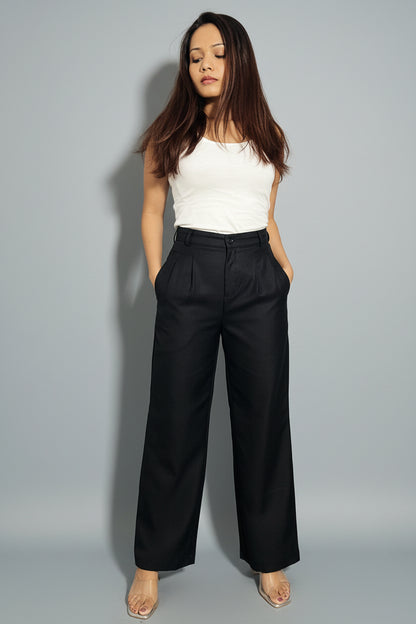 woman wearing black straight fit pleated petite pants