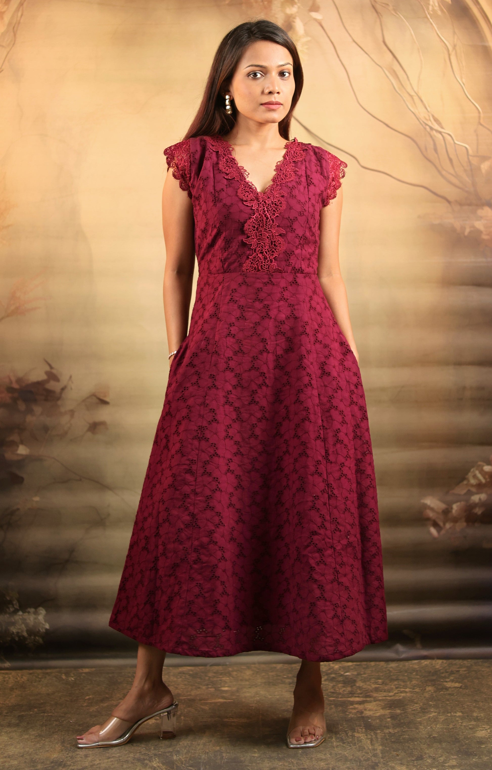 Woman wearing a maroon cotton midi petite dress with lace details