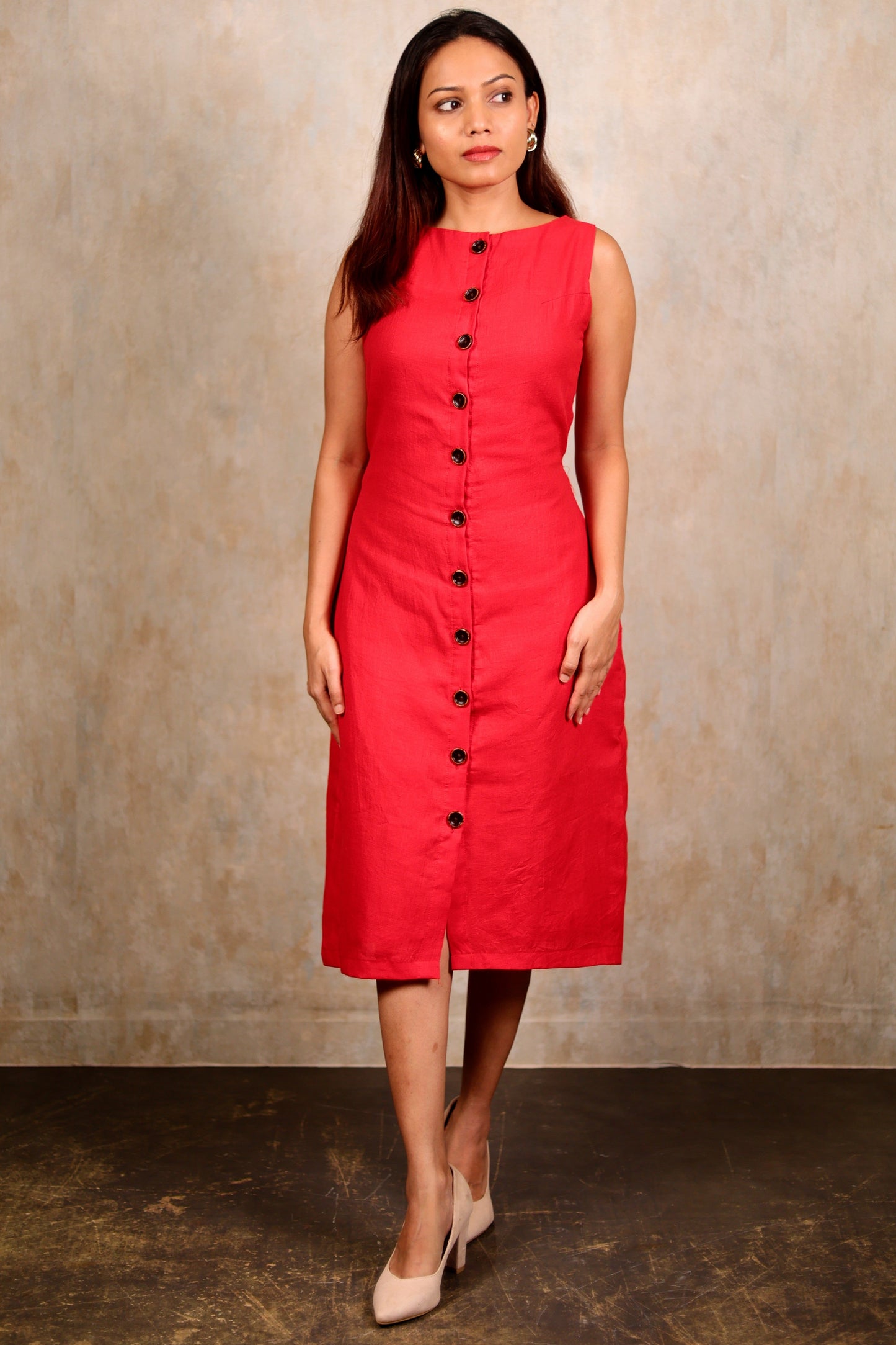 Woman wearing a petite red midi cotton dress with button details